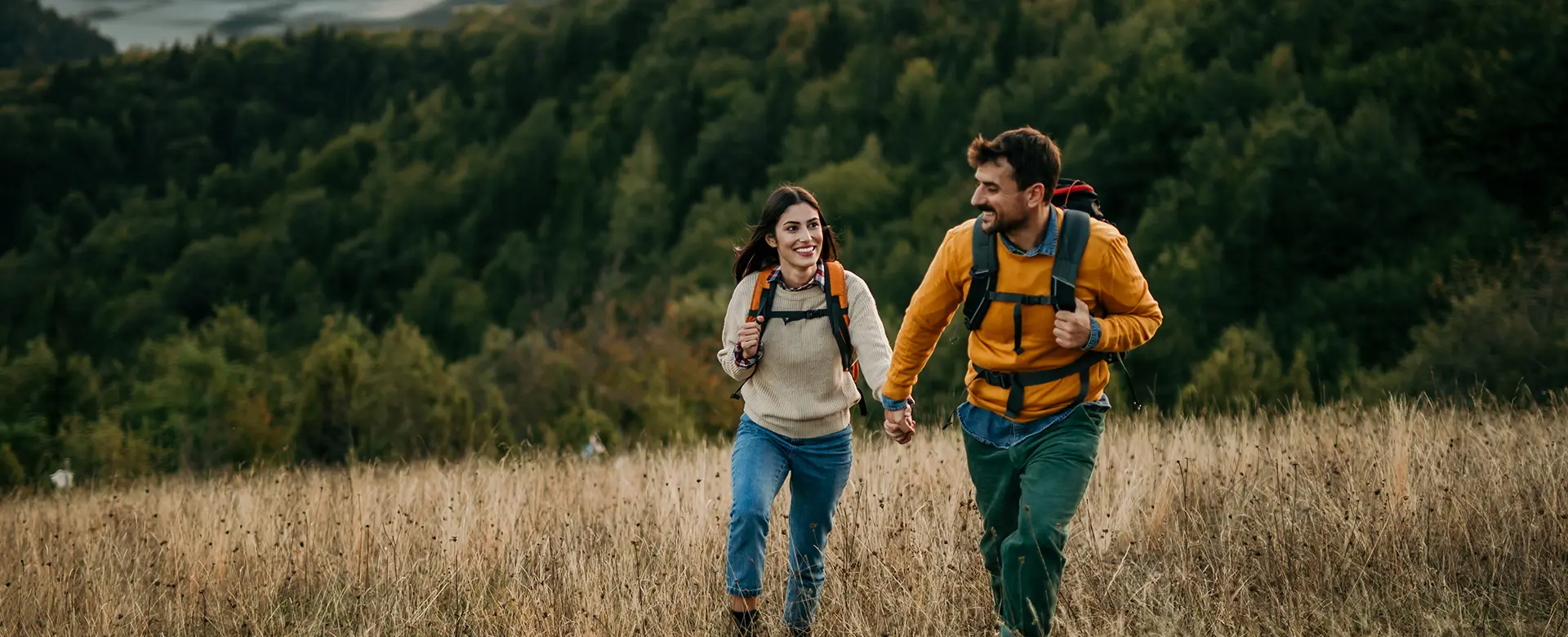 Field with Happy Healthy Couple