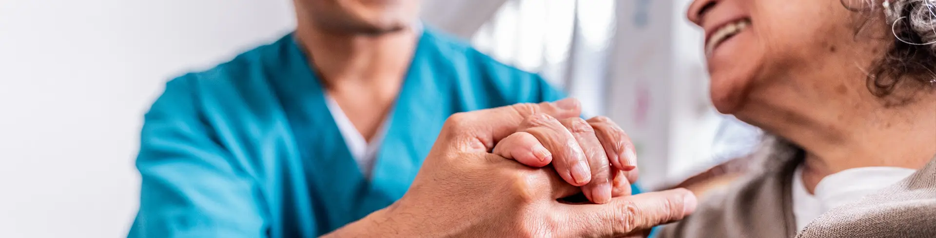 Provider holding patient hand