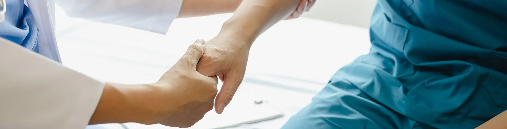Provider Holding Patient Hand